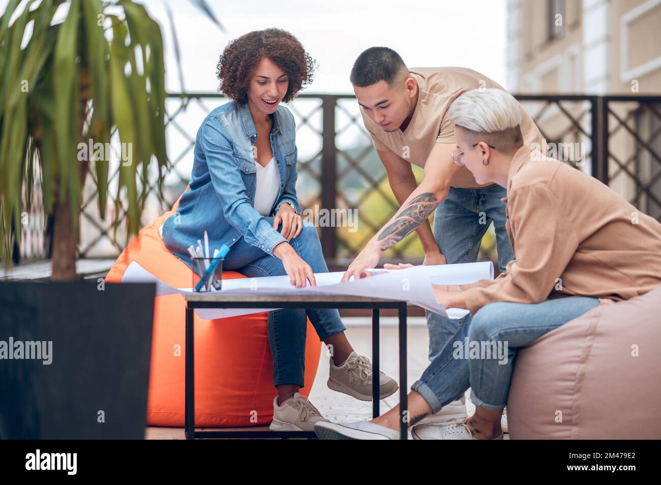 Team of design professionals working on a new construction project Stock Photo