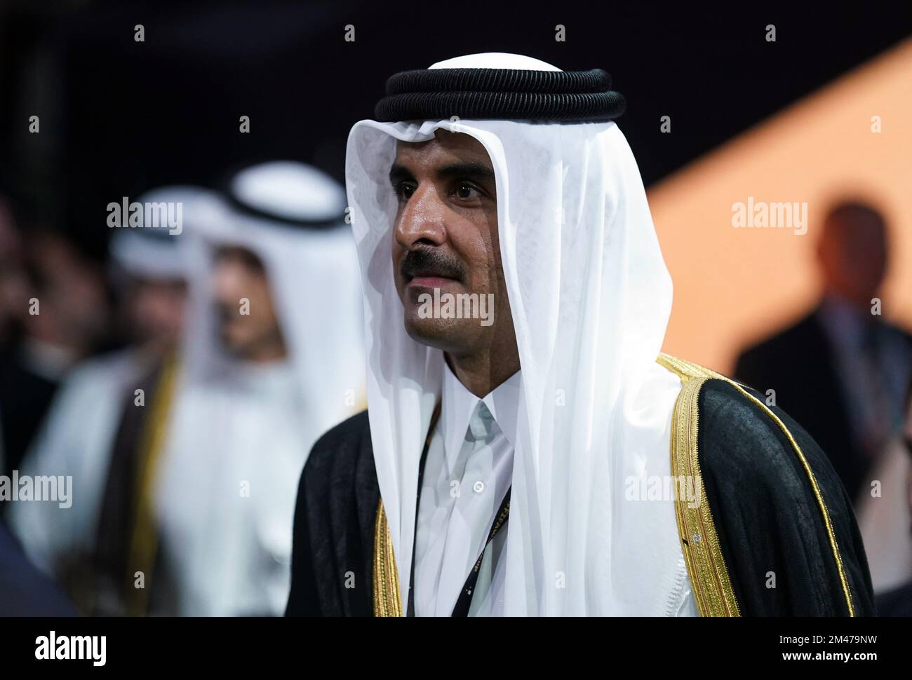Emir of Qatar Sheikh Tamim bin Hamad alThani (left) following the FIFA