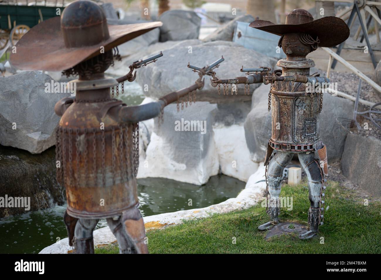 Nice sculpture of two gunmen doing a duel with a revolver, using scrap ...