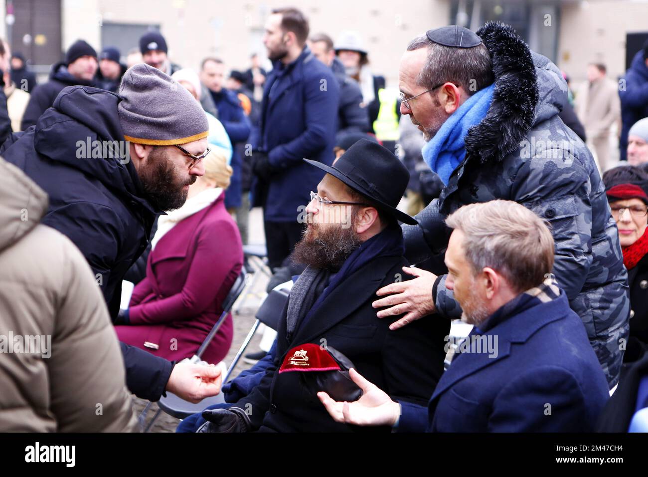 Berlin, Germany. 18th Dec, 2022. (12/18/2022) Berlin: Hanukkah at the Brandenburg Gate - inauguration and ceremony. The lighting of the first Hanukkah candle. The photo shows Federal Finance Minister Christian Lindner and Yehuda Teichtal, Rabbi of the Jewish Community in Berlin (Photo by Simone Kuhlmey/Pacific Press/Sipa USA) Credit: Sipa USA/Alamy Live News Stock Photo