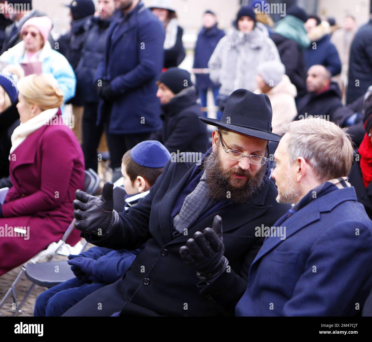 Berlin, Germany. 18th Dec, 2022. (12/18/2022) Berlin: Hanukkah at the Brandenburg Gate - inauguration and ceremony. The lighting of the first Hanukkah candle. The photo shows Federal Finance Minister Christian Lindner and Yehuda Teichtal, Rabbi of the Jewish Community in Berlin (Photo by Simone Kuhlmey/Pacific Press/Sipa USA) Credit: Sipa USA/Alamy Live News Stock Photo