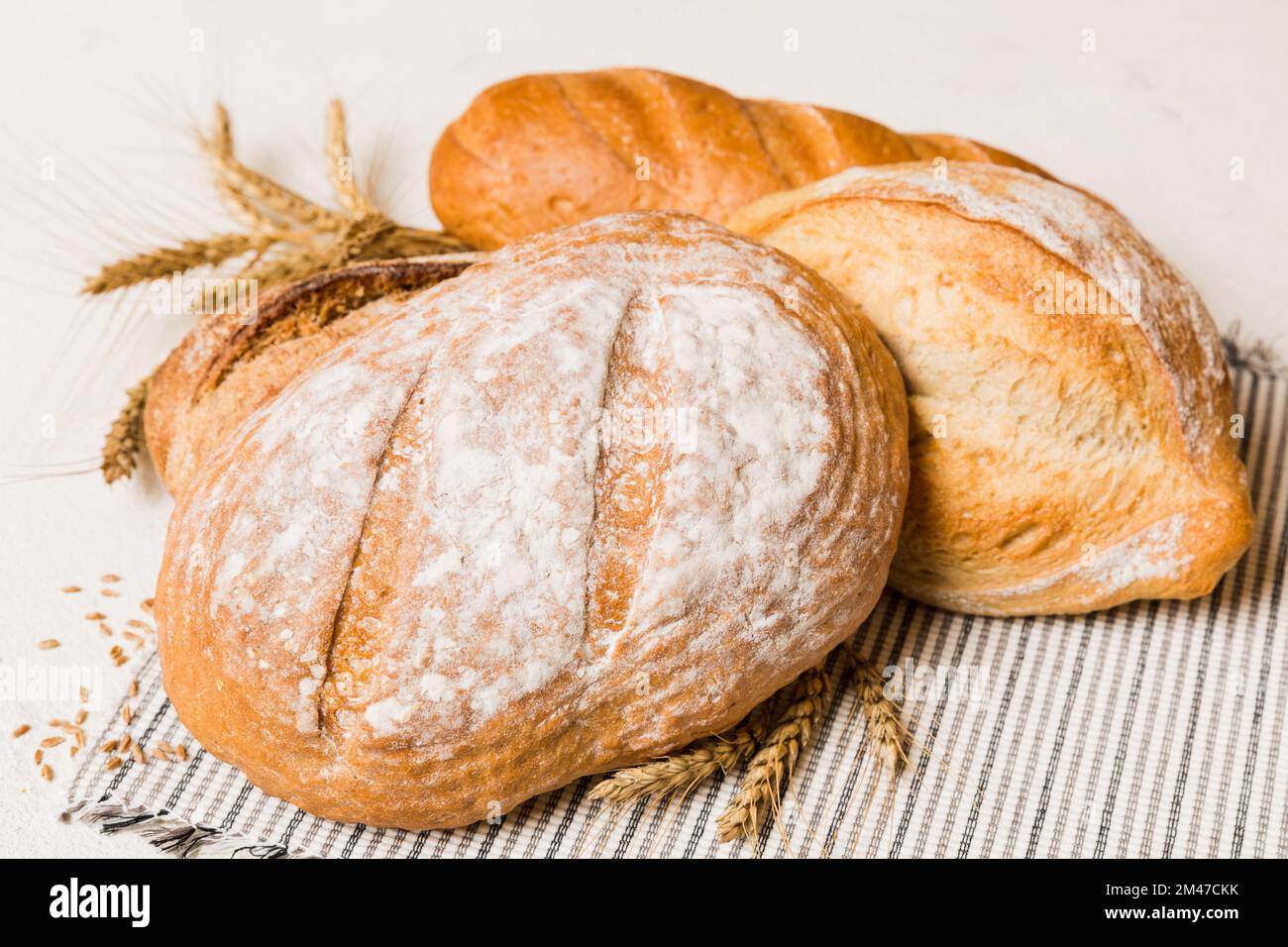 Homemade natural breads. Different kinds of fresh bread as background, perspective view with