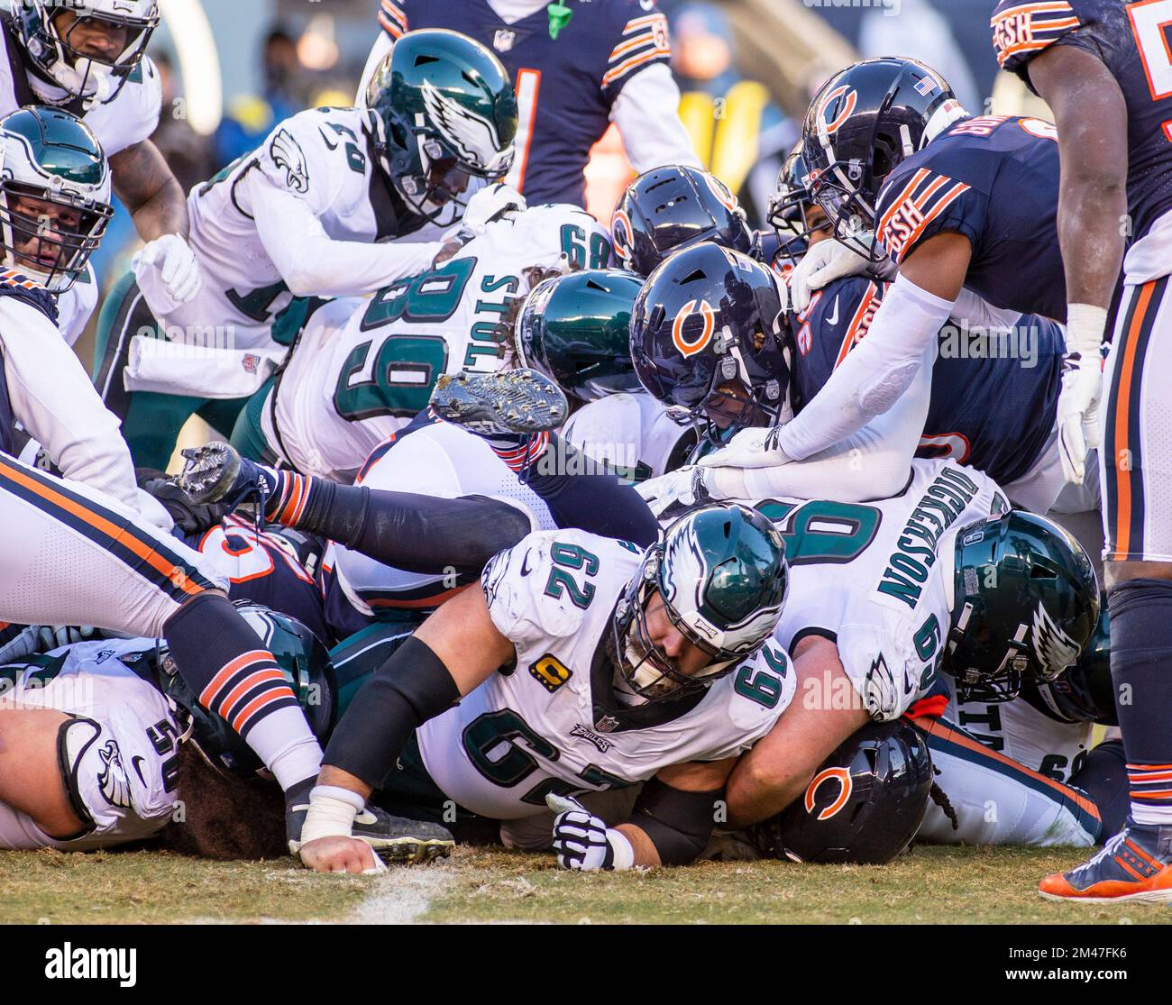 Chicago, IL, USA. 18th Dec, 2022. Philadelphia Eagles #62 Jason Kelce (bottom) looks out from under the pile during a game against the Chicago Bears in Chicago, IL. Mike Wulf/CSM/Alamy Live News Stock Photo