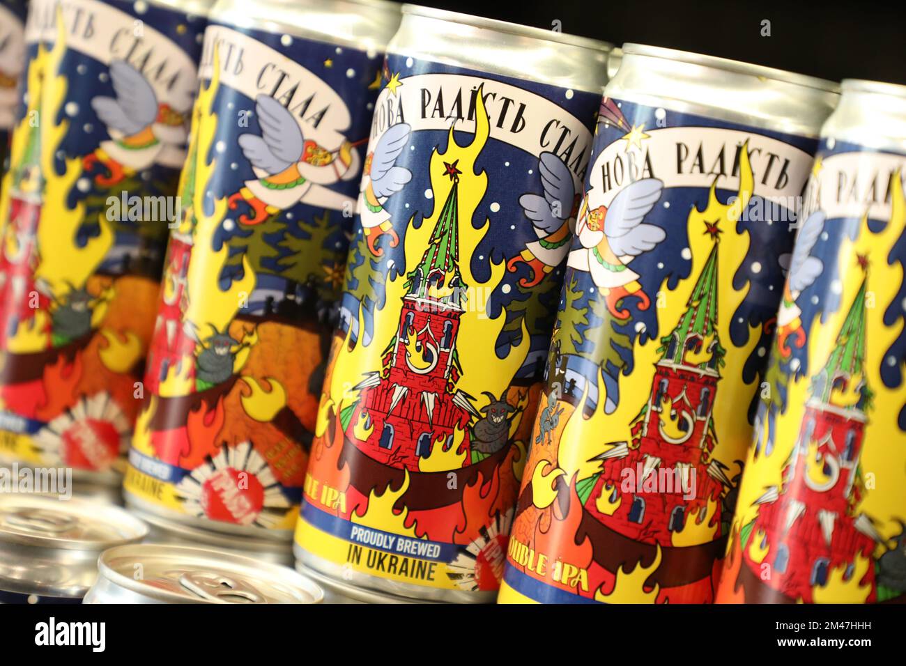 Lviv, Ukraine 19 December 2022. Cans of beer with labels depicting the burning Moscow Kremlin
