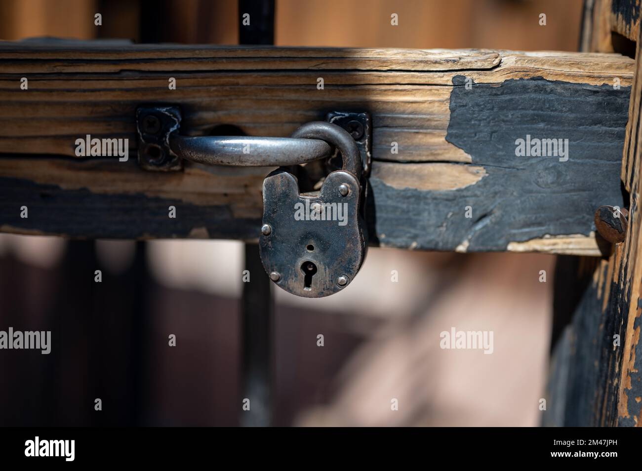 Detail of an old metal padlock with a lock, old jail of the wild west sheriff's office Stock Photo