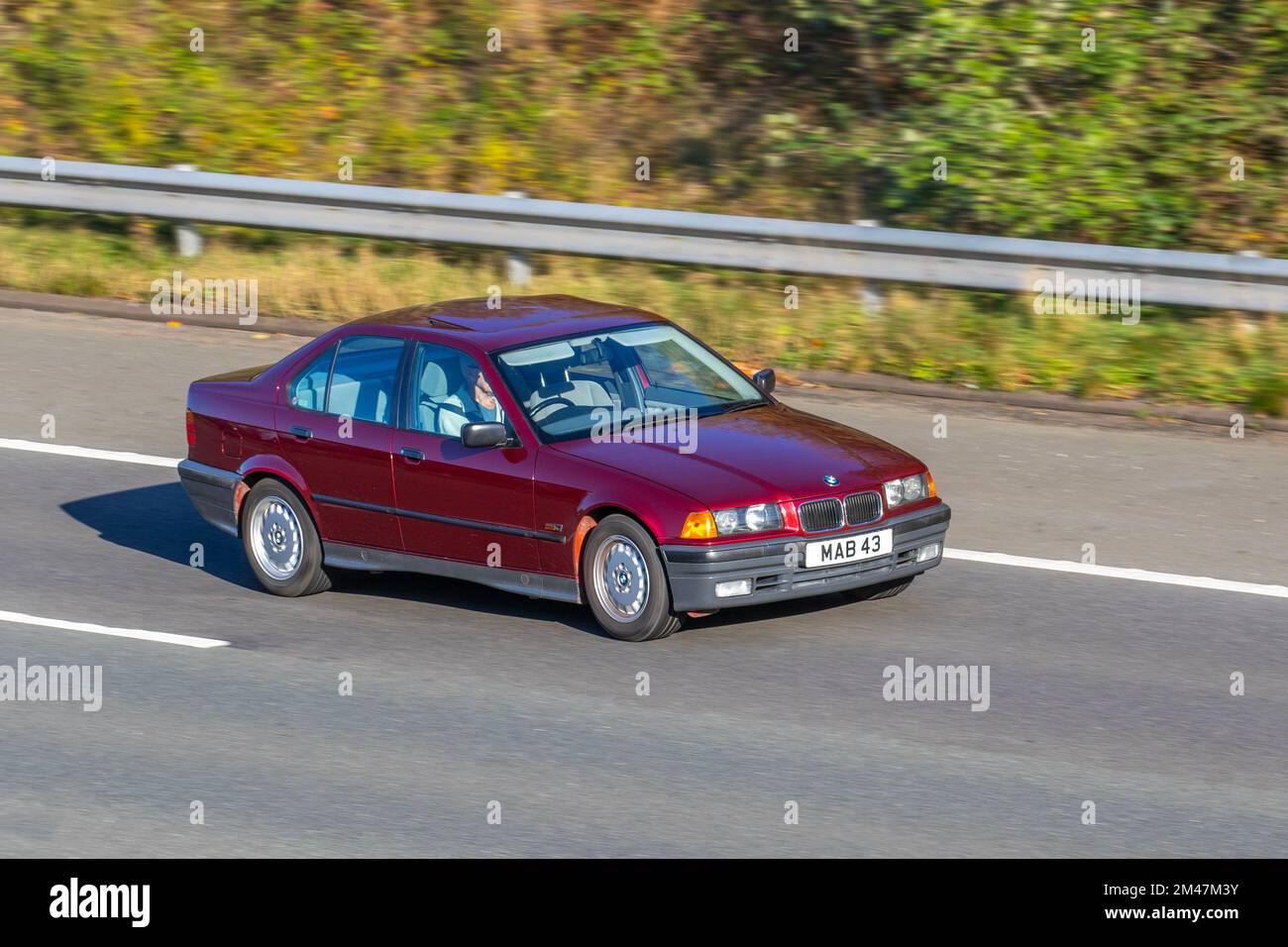 1994 90s nineties Red BMW 316 316I TRGLX 1596cc Petrol 4 spee automatic; travelling on the M6 motorway UK Stock Photo
