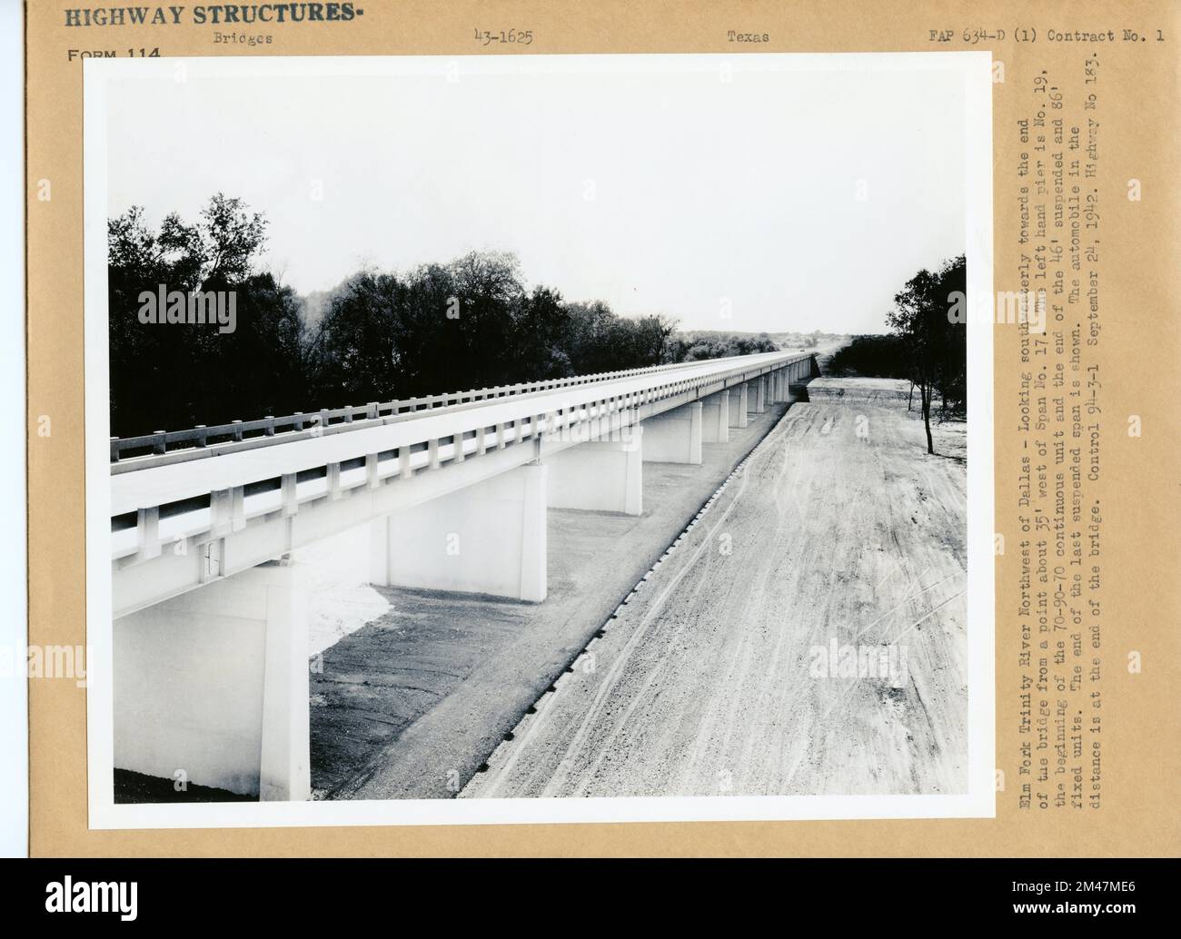 Highway 183 Control bridge. Original caption: Elm Fork Trinity River Northwest of Dallas - Looking southwesterly towards the end of the bridge from a point about 35' west of Span No. 17. The left hand pier is No. 19, the beginning of the 70-90-70 continuous unit and the end of the 46' suspended and 86' fixed units. The end of the last suspended span is shown. The automobile in the distance is at the end of the bridge. Control 94-3-1 September 24, 1942. Highway No 183. FAP 634-D(1). State: Texas. Stock Photo