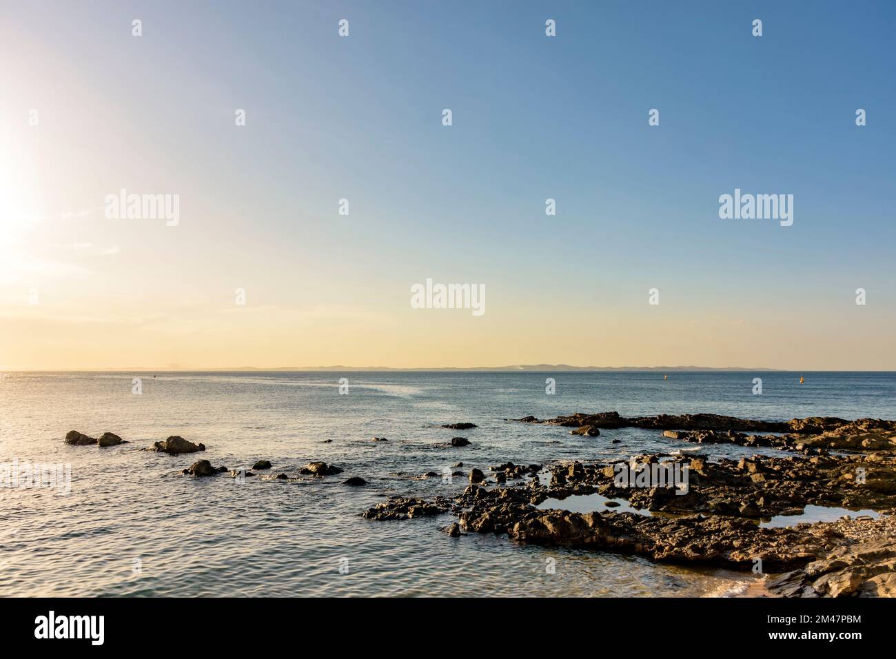 Sunset in the calm waters of All Saints Bay in the city of Salvador in Bahia Stock Photo