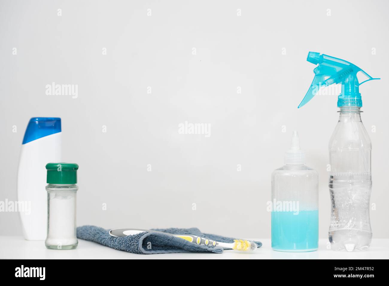 Home cleaning products in reused plastic bottles. Recycled household materials on white background. Horizontal copy space. Save our planet concept. Stock Photo