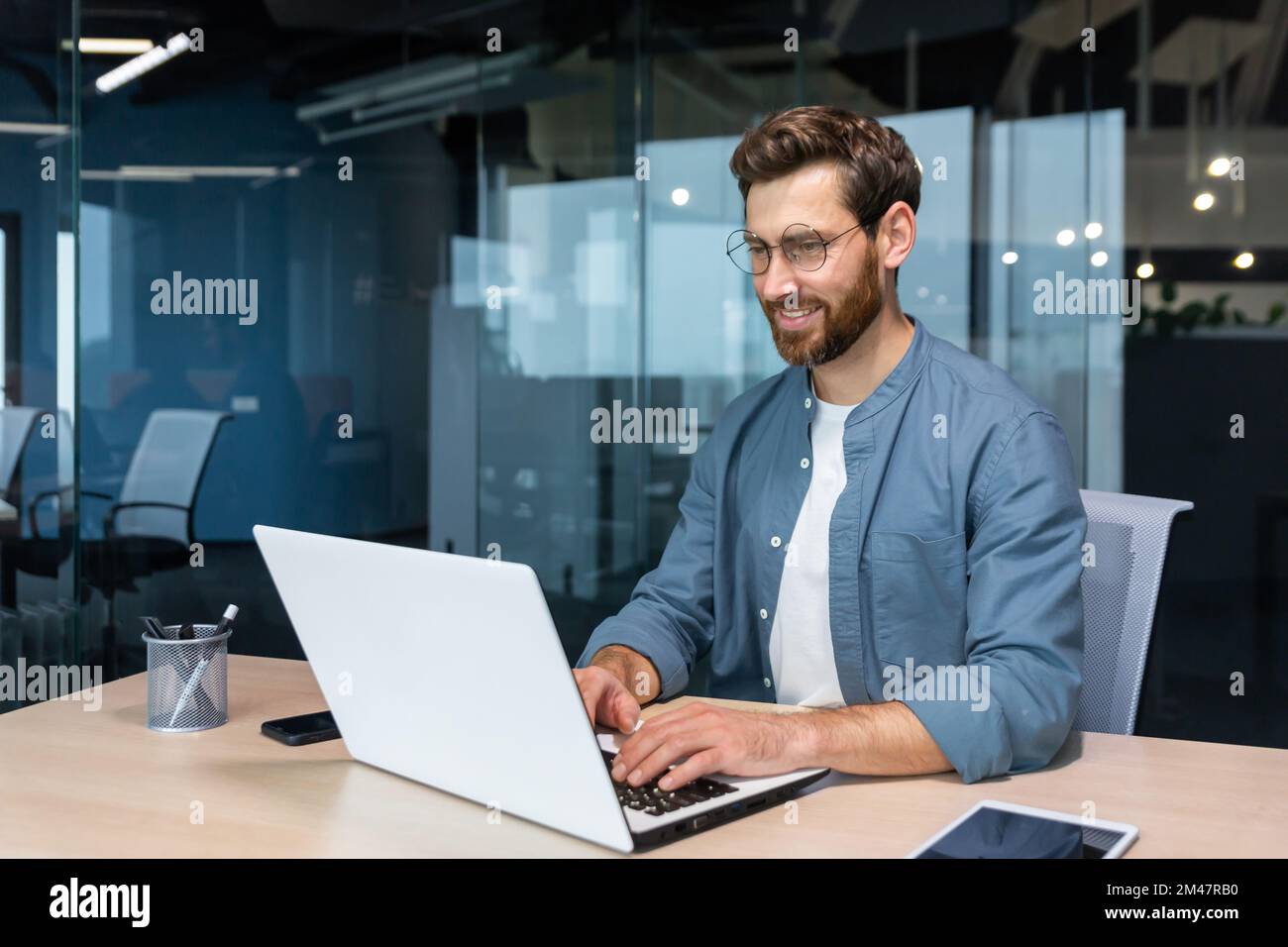 Positive programmer smiling solving hi-res stock photography and images ...