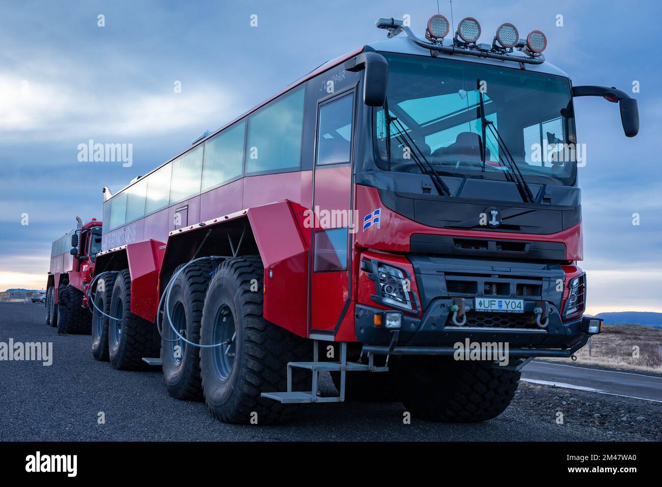 Gulfoss, Iceland - November 27, 2022: Red 8 wheel monster truck, used for organized tours to icelandic glaciers and highlands. Stock Photo