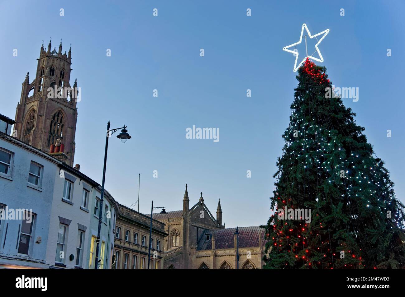 Looking up at a Christmas tree and Boston stump tower in the marketplace at sundown. Stock Photo