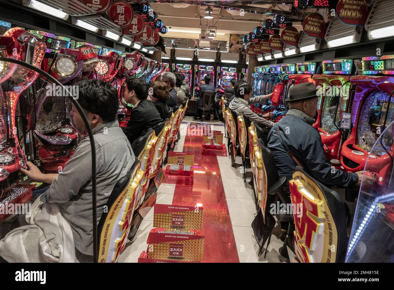 Tokyo- Japan- Circa November 2018. Japanese people playing slot machines at at one of numerous gambling hall in Shinjuku Stock Photo