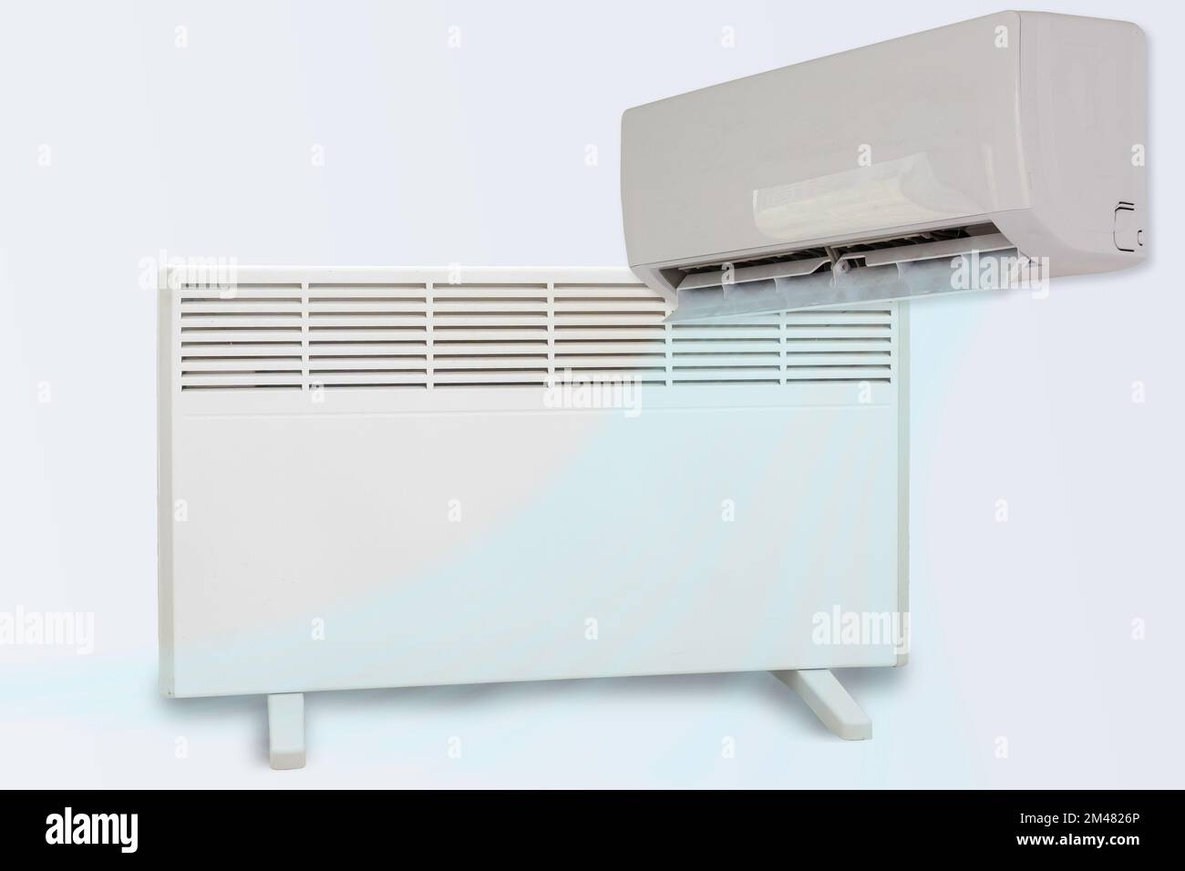 Modern electric heater and air conditioner on a white background Stock