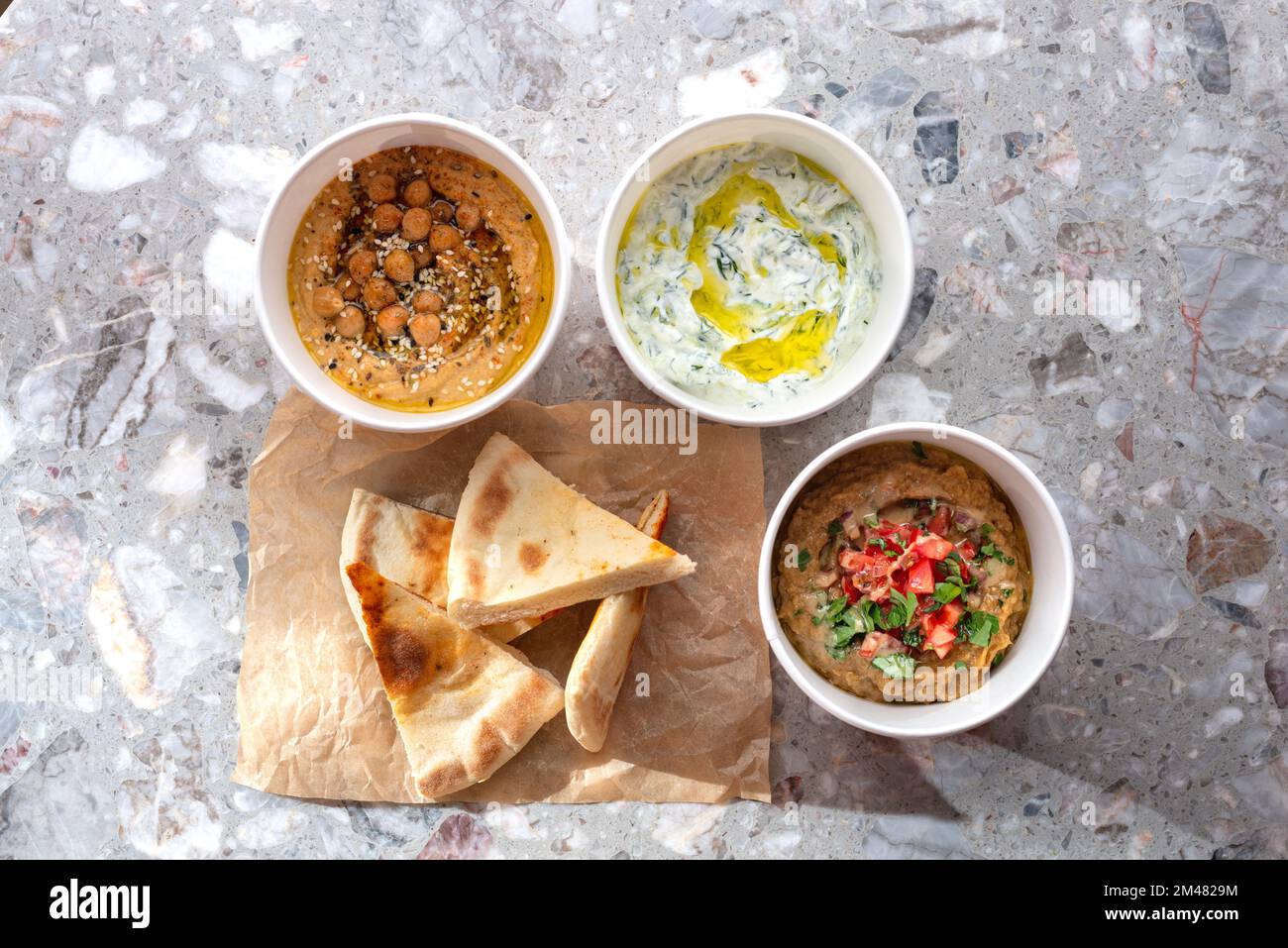Pita with assorted traditional greek dips, tzatziki, vegetable caviar
