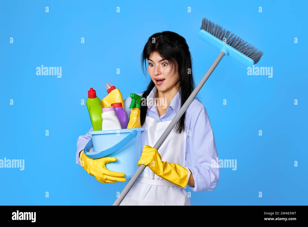 woman in gloves holding bucket of detergents and broom Stock Photo - Alamy