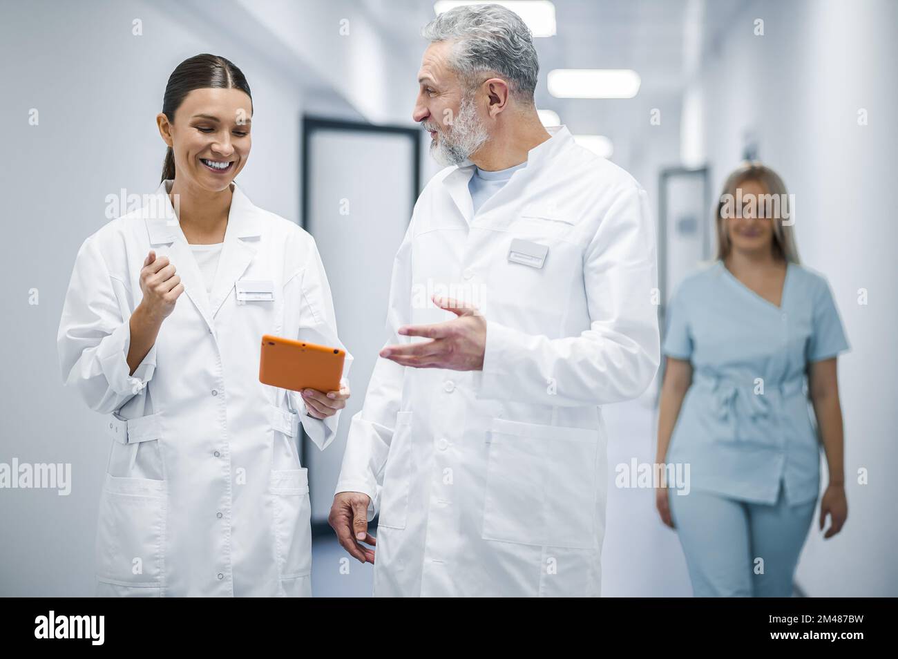 Colleagues discussing something in the clinic corridor Stock Photo