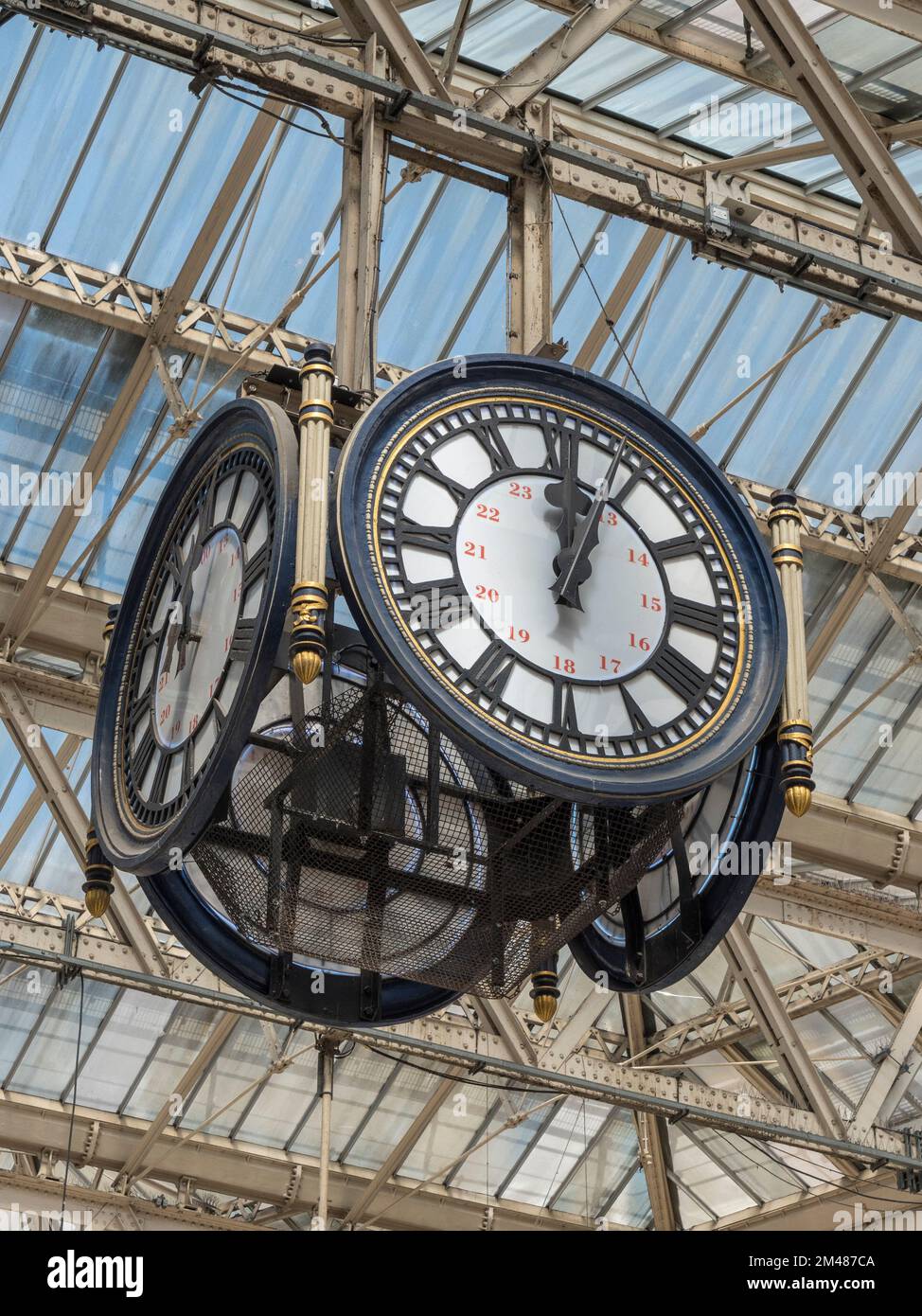 the famous  four-sided hanging clock in Waterloo mainline station, London which is a major meeting point UK. Stock Photo
