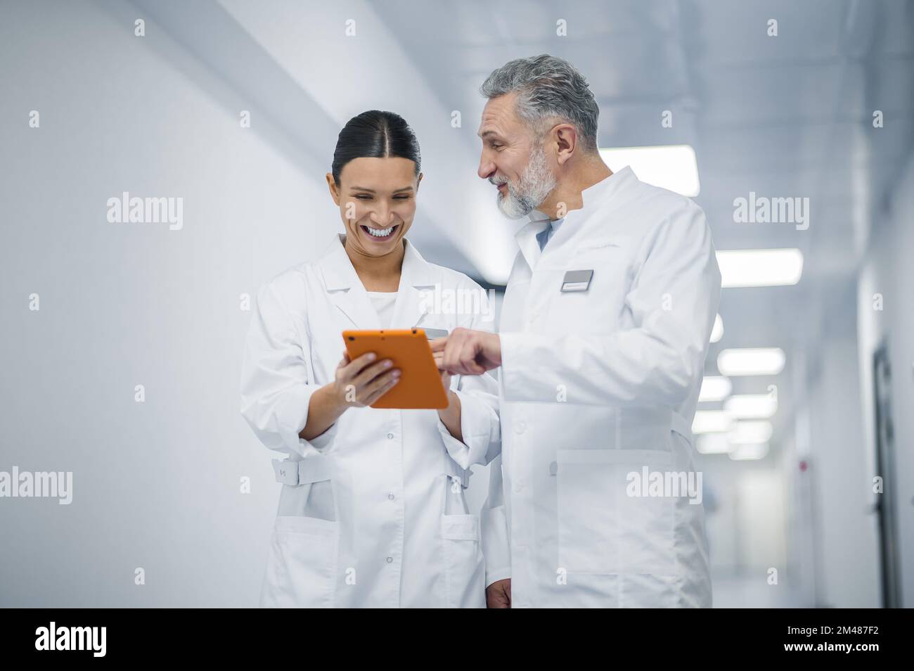 Colleagues discussing something in the clinic corridor Stock Photo