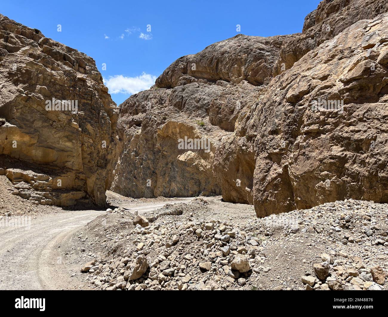 A hiking path between rocky cliffs trails in Titus Canyon Road in Los ...