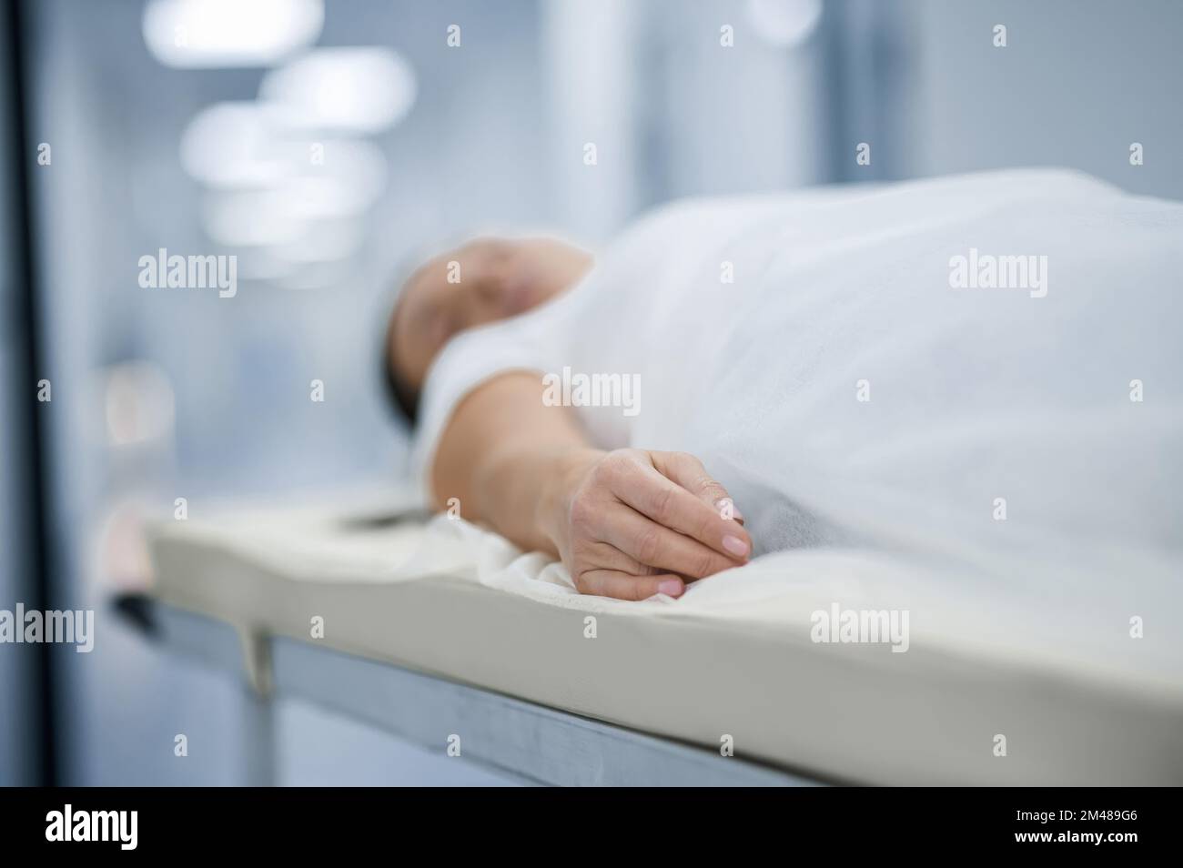 A woman lying on a gurney befre diagnostic procedure Stock Photo Alamy