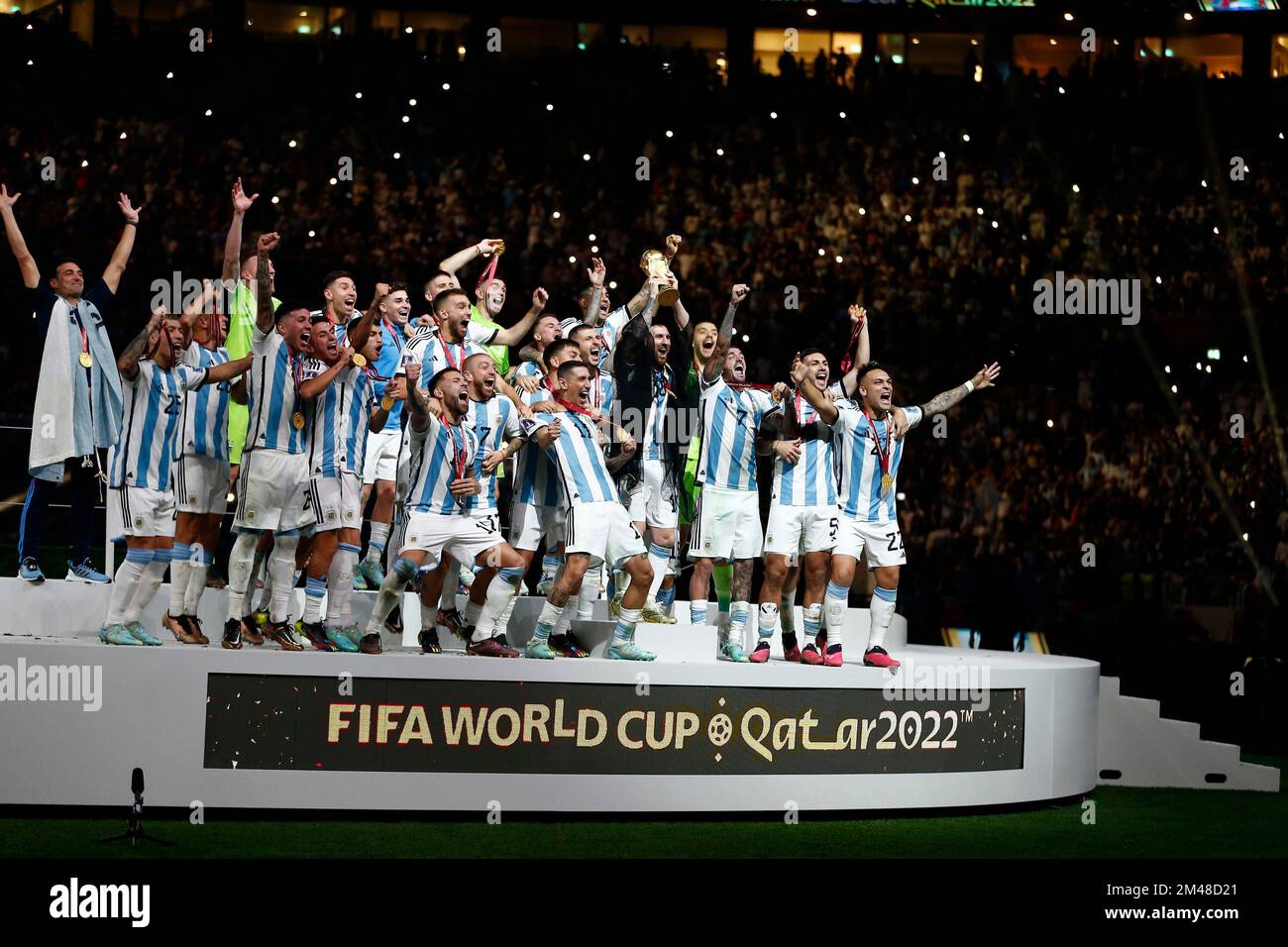LUSAIL, QATAR - DECEMBER 18: Player of Argentina Lionel Messi celebrates with the FIFA World Cup trophy following victory over France in the FIFA World Cup Final match between Argentina and France at Lusail Stadium on December 18, 2022 in Lusail, Qatar. (Photo by Florencia Tan Jun/PxImages) Stock Photo