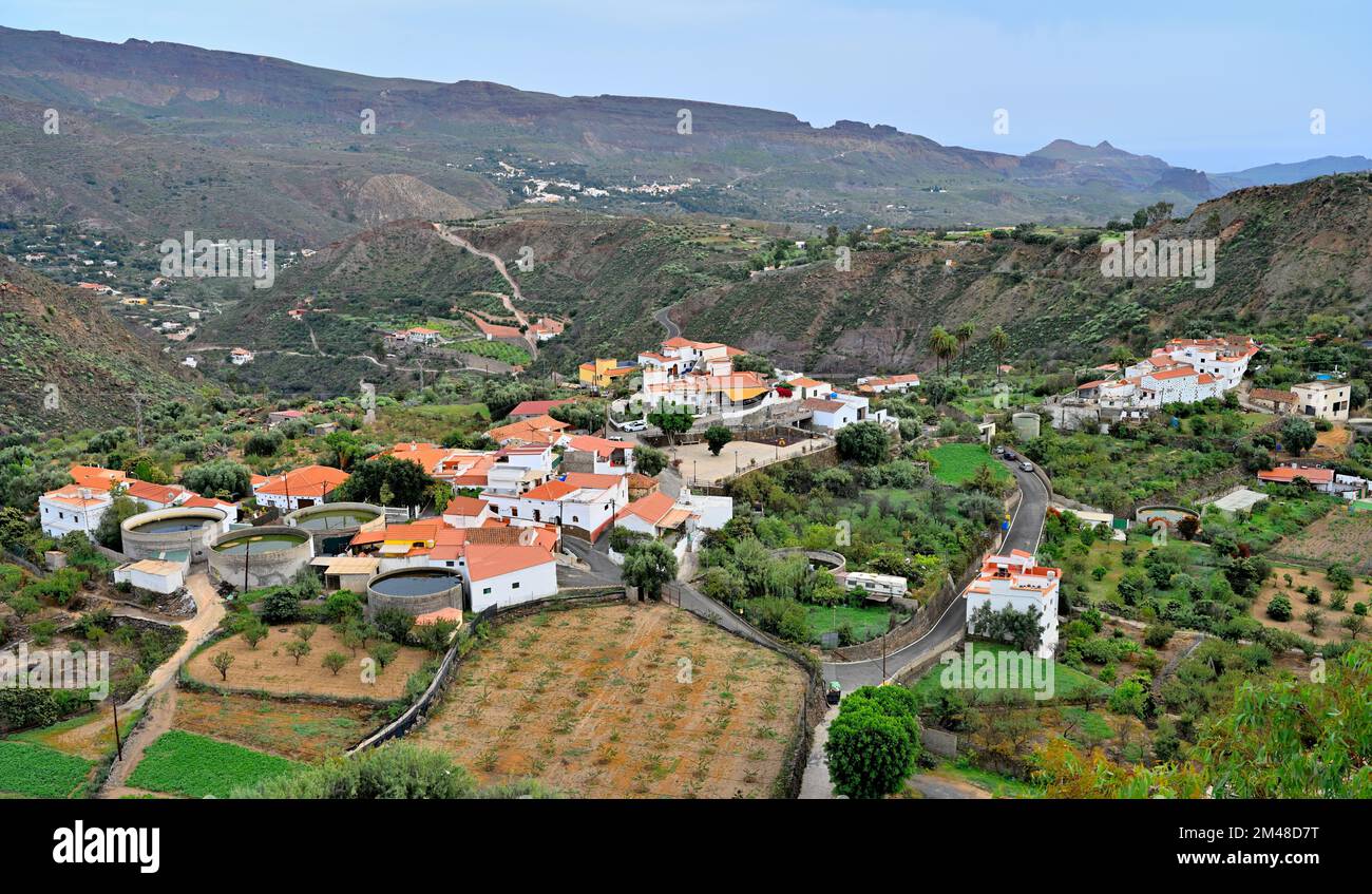 View over lower section of  picturesque Village of San Bartolomé de Tirajana with white houses in the mountains, Gran Canaria Stock Photo