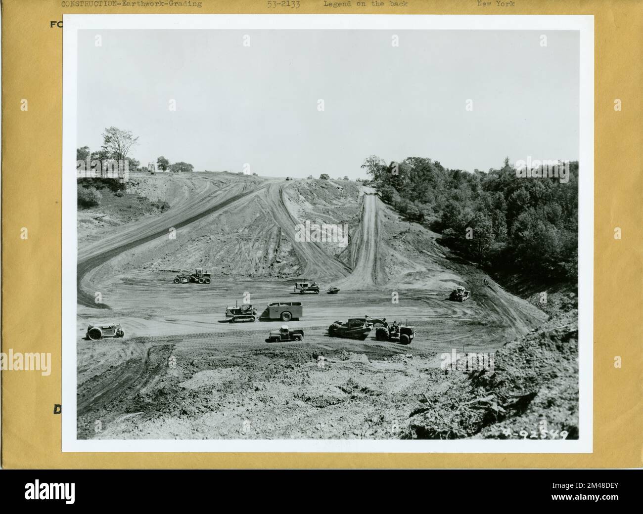 Earthwork Construction Equipment. Original caption: Construction near Herkimer, New York of the New York Thruway. Equipment includes Caterpillar DW20 Tractors with No. 20 Scrapers, D8 Tractors and No. 12 Motor Graders. Credit: Caterpillar Tractor Co., Peoria, Ill. State: New York. Stock Photo