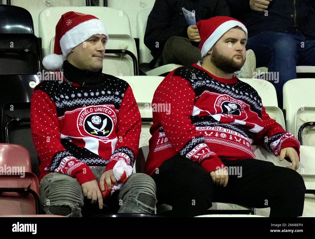 Wigan, England, 19th December 2022. Sheffield Utd fans in Christmas jumpers  during the Sky Bet Championship match at the DW Stadium, Wigan. Picture credit should read: Andrew Yates / Sportimage Stock Photo