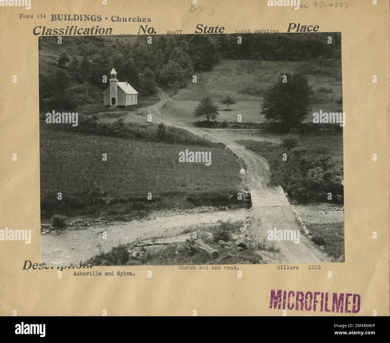 Church and Bad Road. Original caption Muddy road by church in North