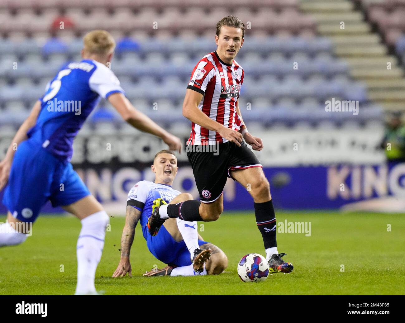 Wigan, England, 19th December 2022.  Sander Berge of Sheffield Utd moves away from James McClean of Wigan Athletic during the Sky Bet Championship match at the DW Stadium, Wigan. Picture credit should read: Andrew Yates / Sportimage Stock Photo