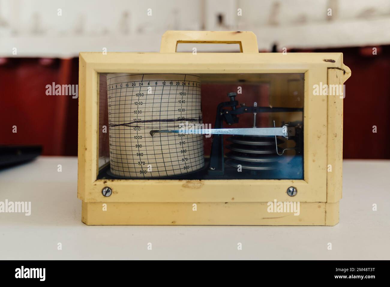 Old vintage marine barograph in plastic box. Stock Photo