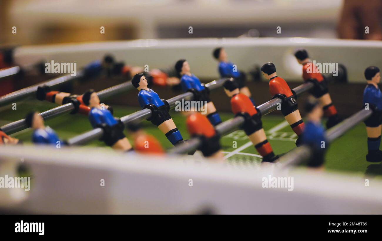 Players play table football in the clubhouse Stock Photo Alamy