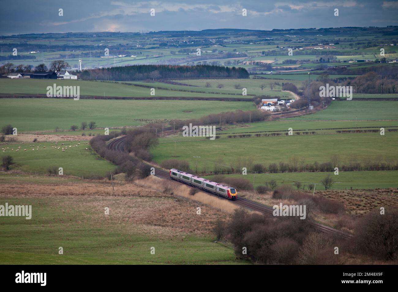 Virgin Trains class 221 voyager train passing Mossgiel, in rural southern Scotland  with a diverted Anglo Scottish train Stock Photo