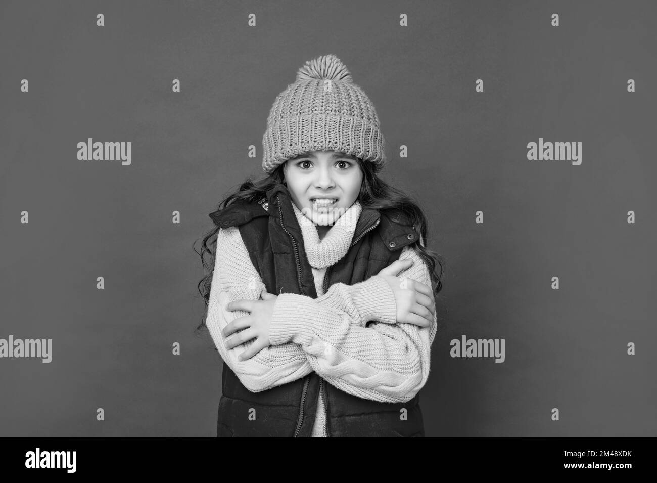 female fashion model. teen girl in down vest. portrait of child wearing