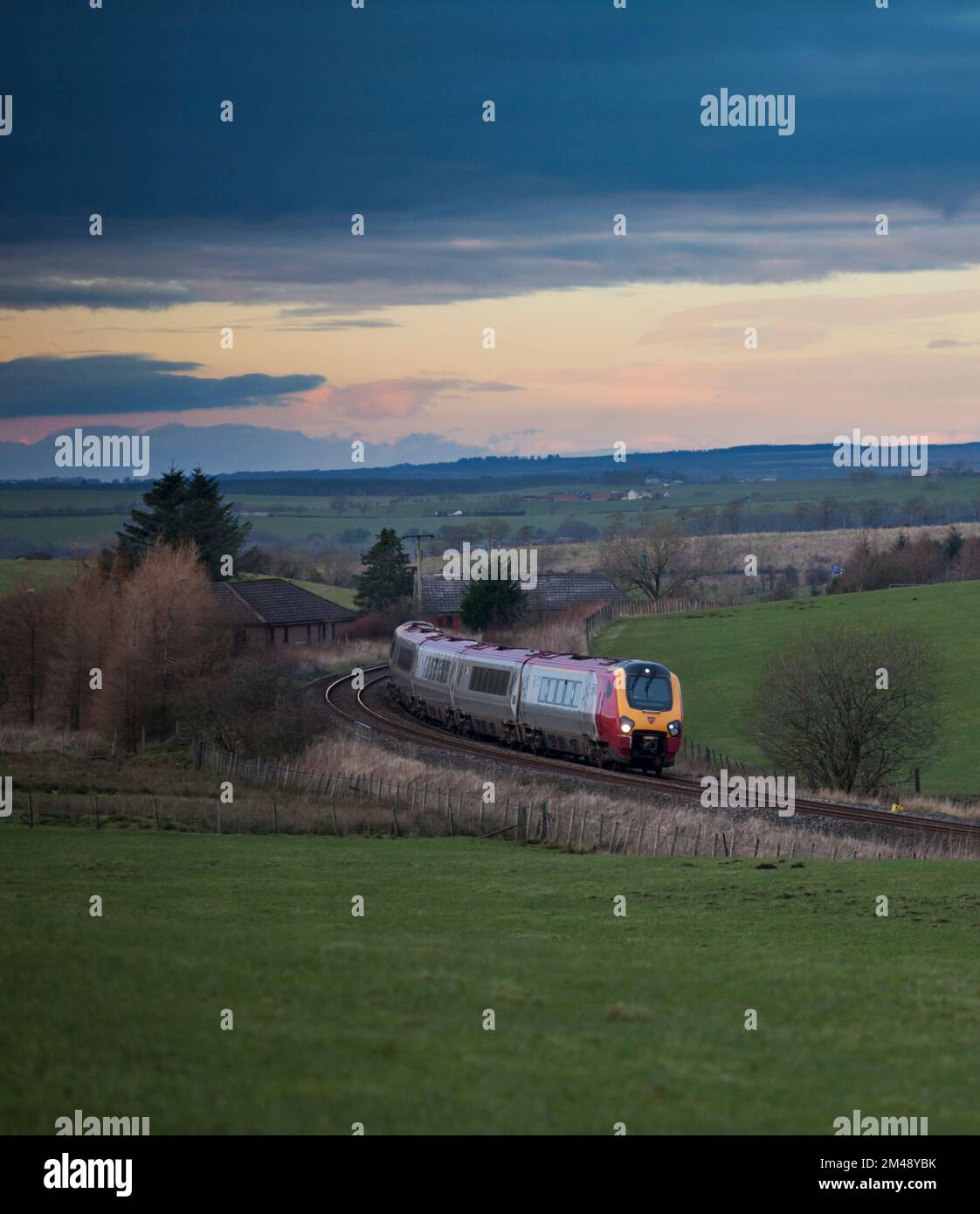 Virgin Trains class 221 voyager train passing Polquip, in rural southern Scotland with a diverted Anglo Scottish train Stock Photo