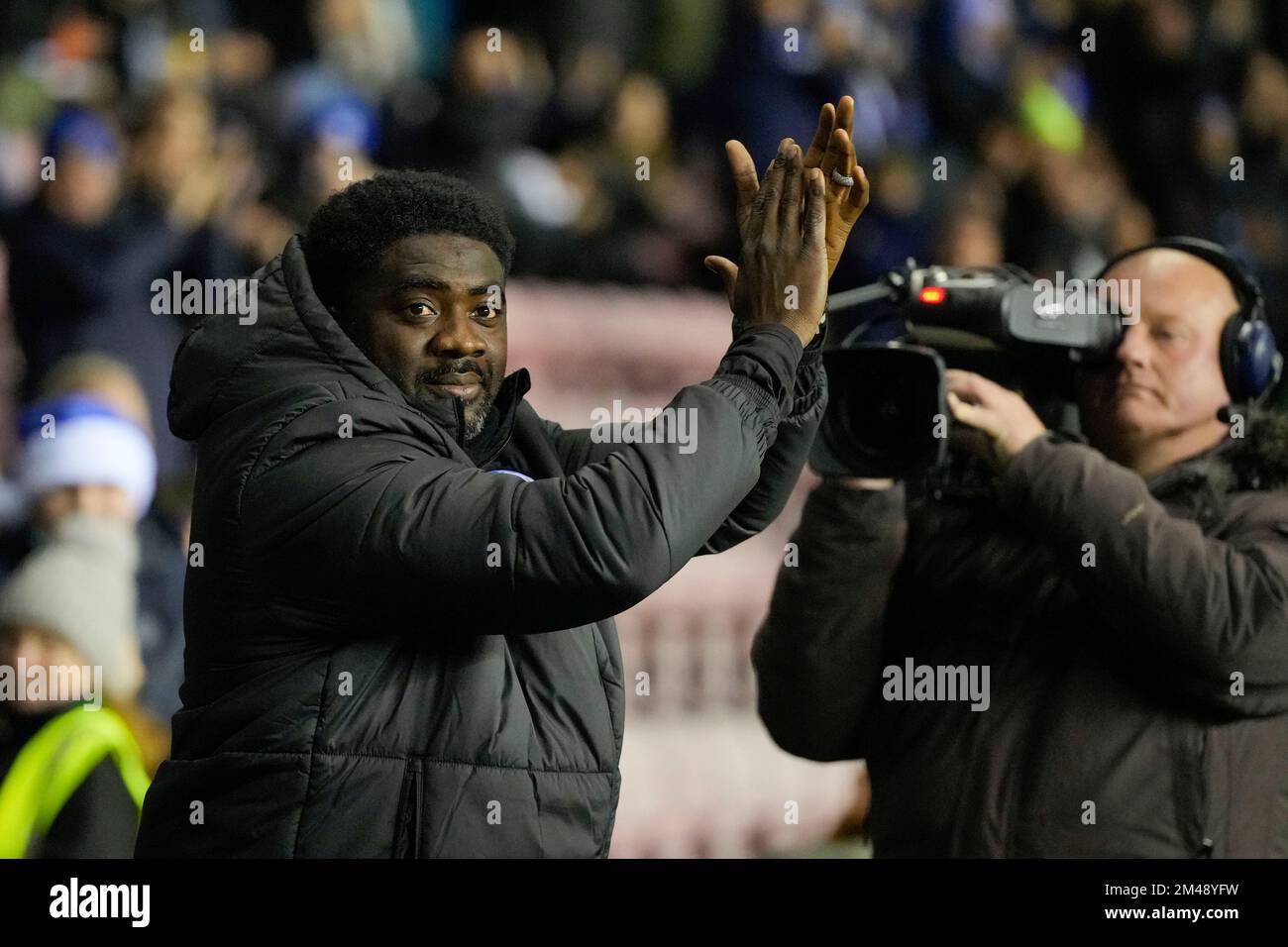 Wigan, UK. 19th Dec, 2022. Kolo Toure Manager of Wigan Athletic salutes the fans before the Sky Bet Championship match Wigan Athletic vs Sheffield United at DW Stadium, Wigan, United Kingdom, 19th December 2022 (Photo by Steve Flynn/News Images) in Wigan, United Kingdom on 12/19/2022. (Photo by Steve Flynn/News Images/Sipa USA) Credit: Sipa USA/Alamy Live News Stock Photo