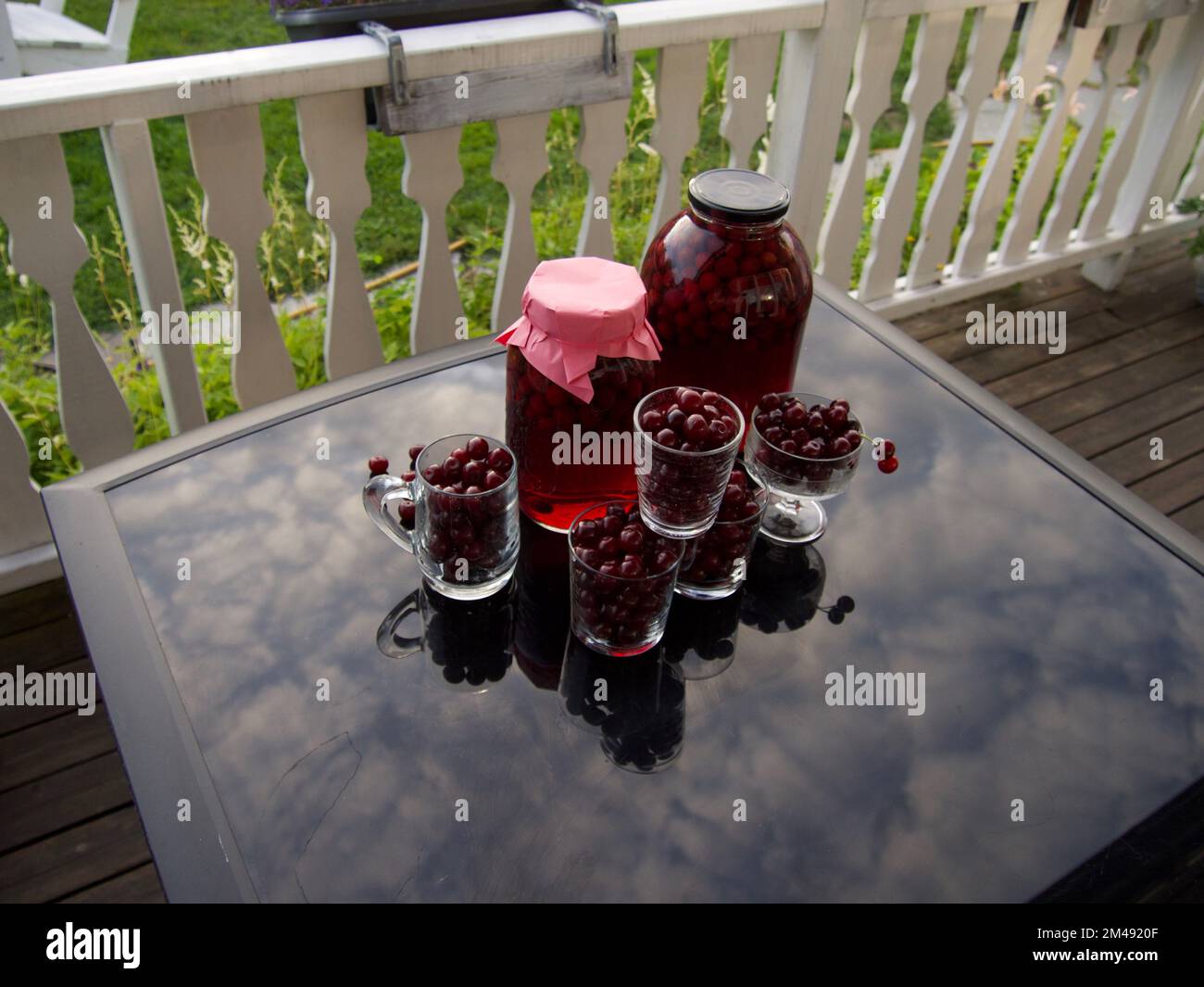 cherry compote drink on table background Stock Photo Alamy