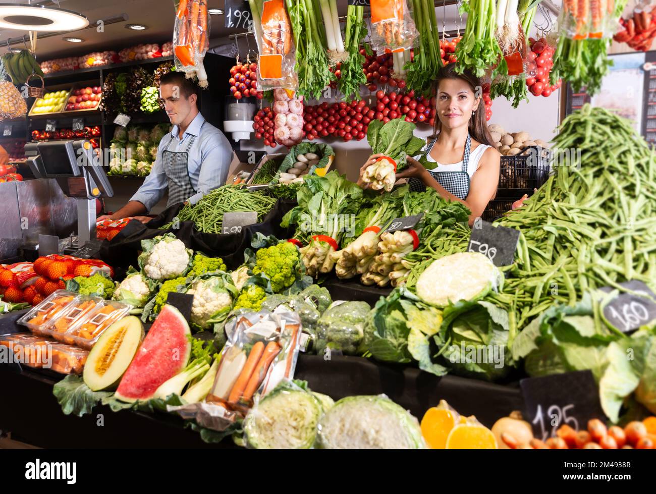 Young man selling fruit vegetables hi-res stock photography and images ...
