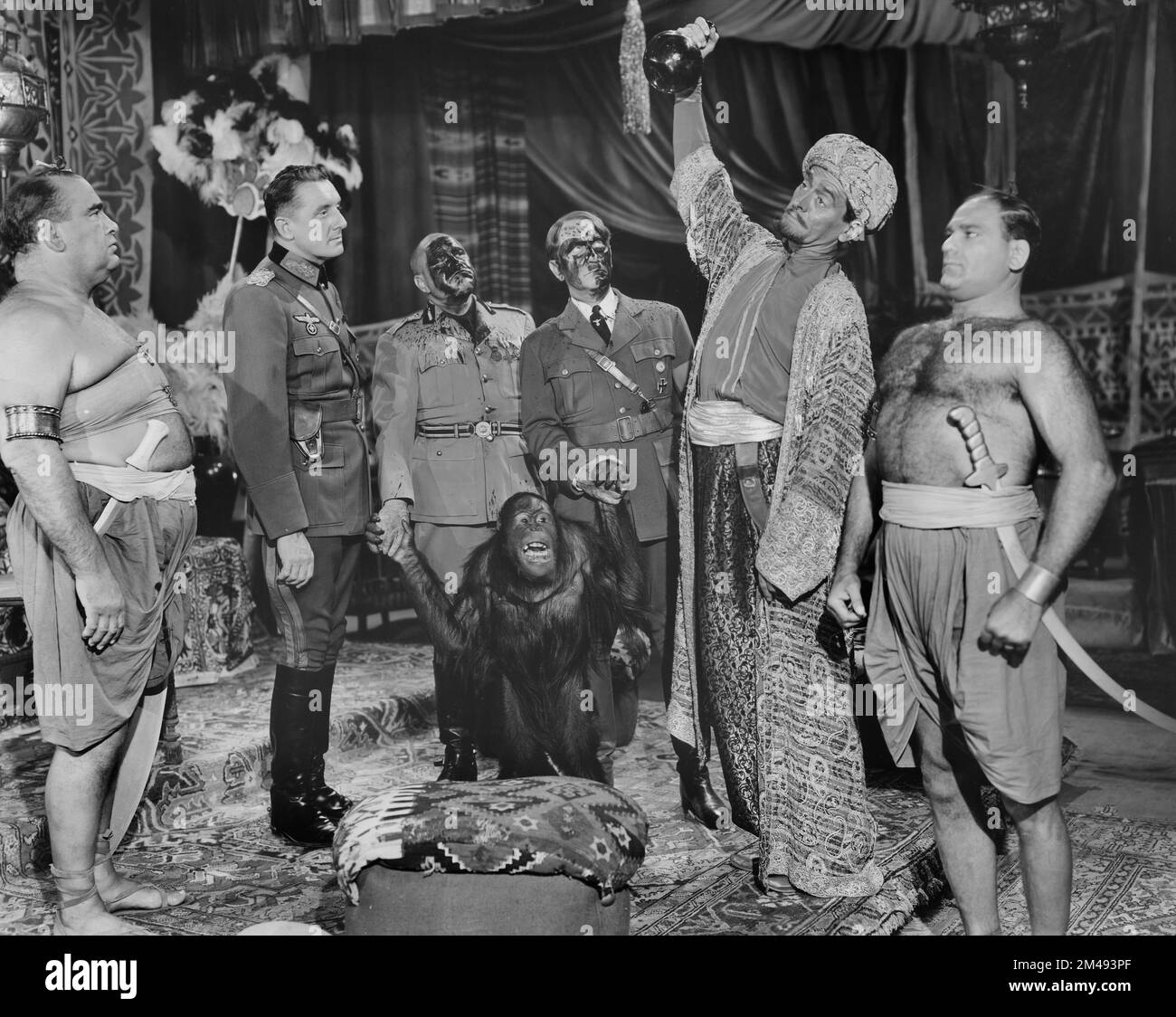 Alan Mowbray, Joe Devlin, Bobby Watson (as Adolf Hitler), onset of the