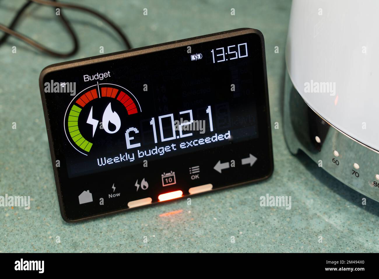 Smart energy meter showing electricity usage & that the weekly budget has been exceeded. Theme: cost of living, rising energy bills, living standards Stock Photo