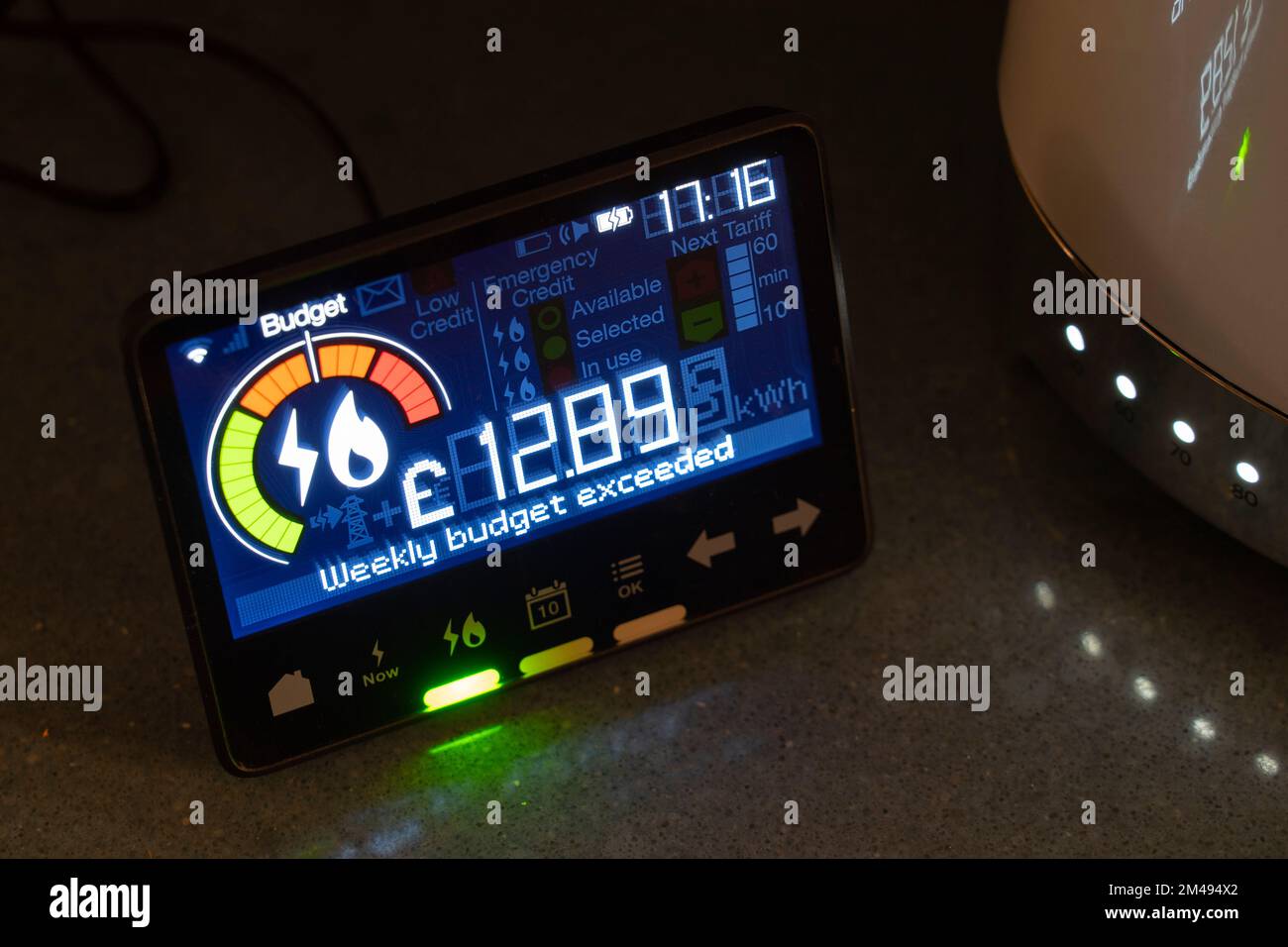 Smart energy meter showing electricity usage & that the weekly budget has been exceeded. Theme: cost of living, rising energy bills, living standards Stock Photo