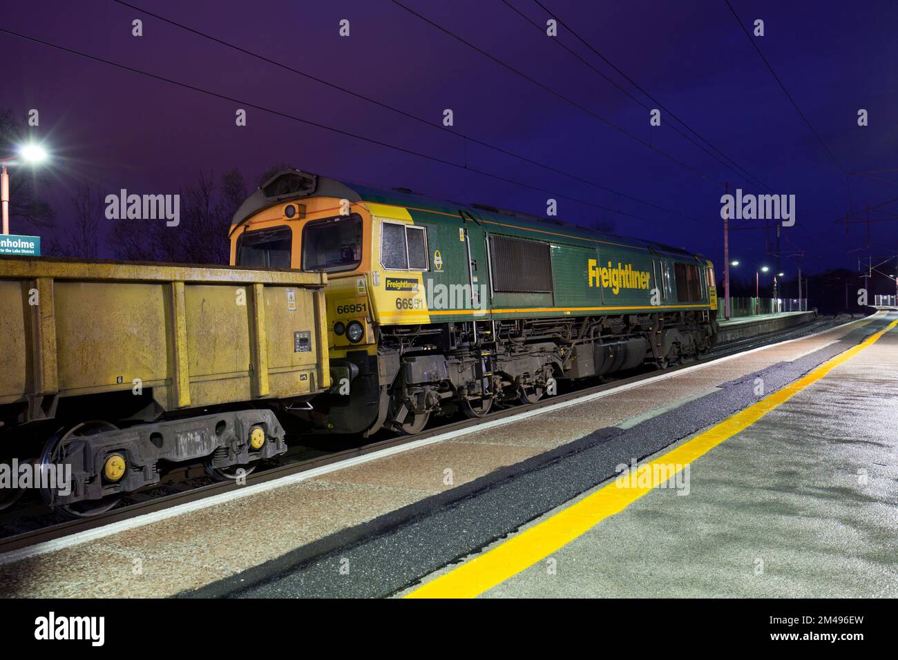 Freightliner class 66 diesel locomotive  at Oxenholme The lake District railway station in a engineers possession waiting while ballast is unloaded Stock Photo