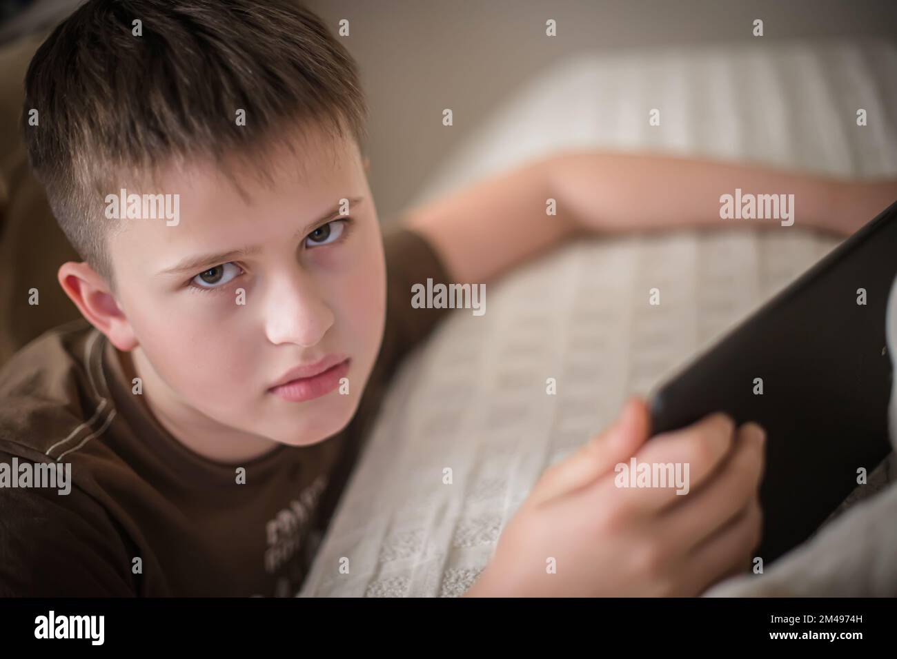 An angry teenager with a gadget is offended that he was disturbed