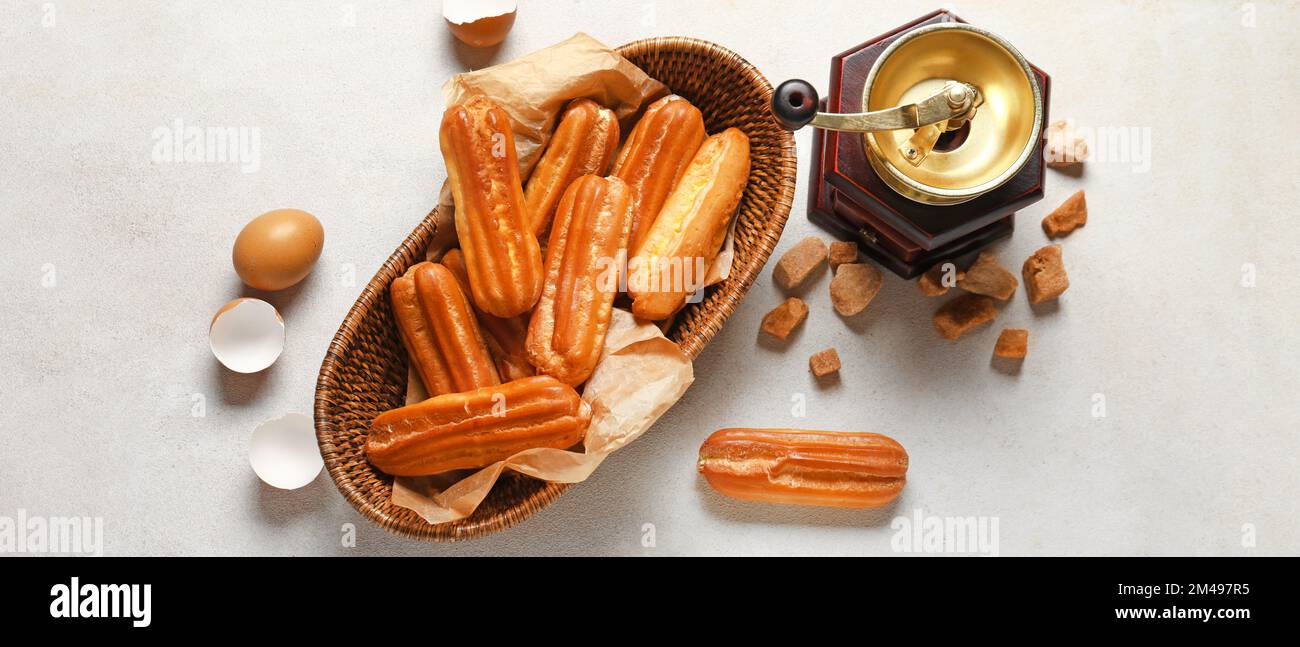 Composition with sweet eclairs on light background, top view Stock Photo