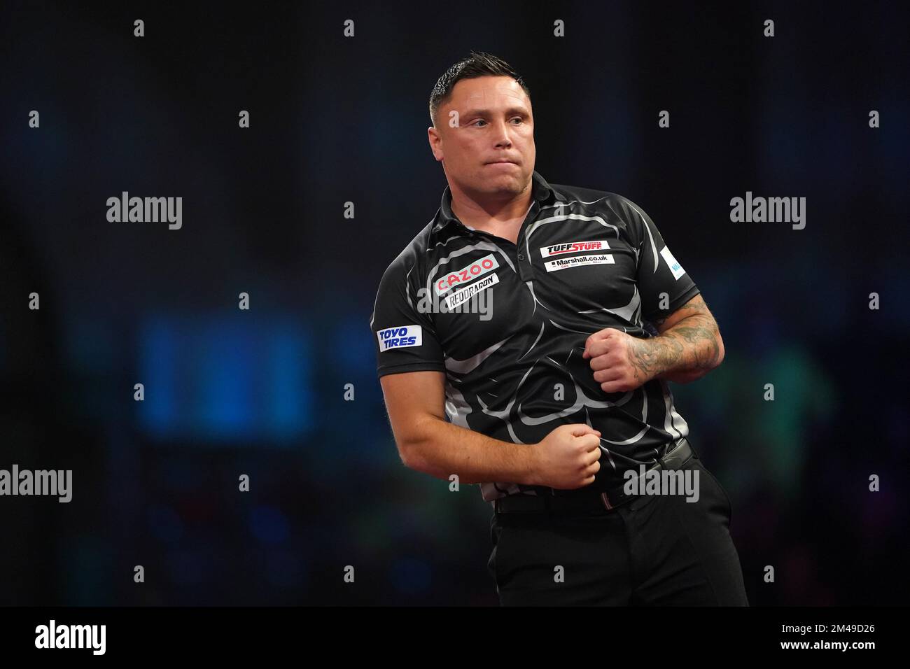 Wales' Gerwyn Price in action against England's Luke Woodhouse during day five of the Cazoo