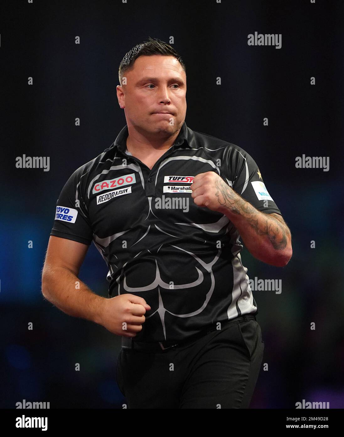 Wales' Gerwyn Price in action against England's Luke Woodhouse during day five of the Cazoo