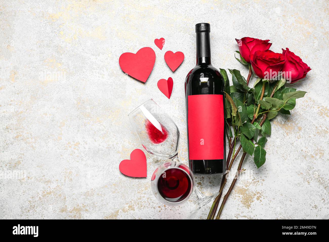 Bottle of wine, glasses, roses and hearts on grunge background ...