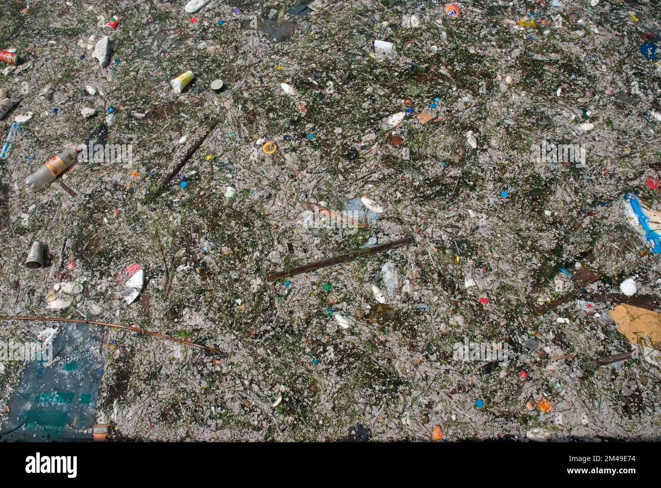 Polluted river with civilization waste Stock Photo - Alamy