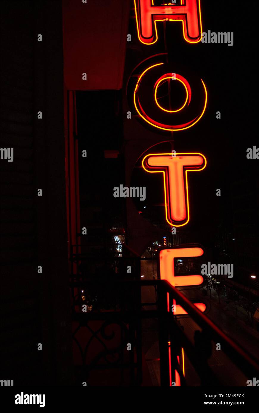 Hotel sign made of neon lights at night Stock Photo - Alamy